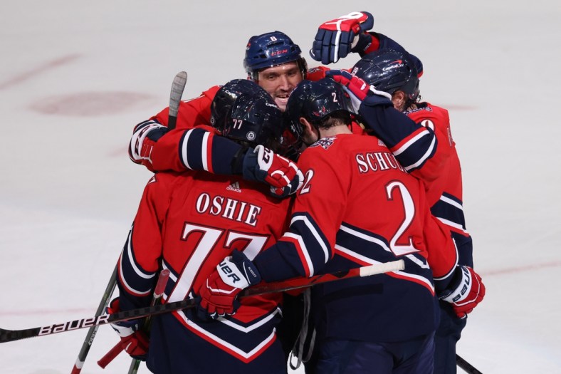 Mar 9, 2021; Washington, District of Columbia, USA; Washington Capitals right wing T.J. Oshie (77) celebrates with teammates after scoring goal against the New Jersey Devils in the first period at Capital One Arena. Mandatory Credit: Geoff Burke-USA TODAY Sports