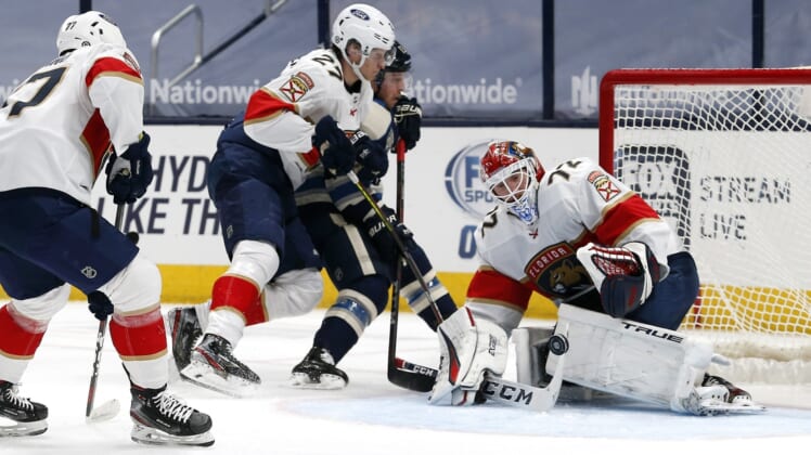 Mar 9, 2021; Columbus, Ohio, USA; Florida Panthers goalie Sergei Bobrovsky (72) stops the shot of Columbus Blue Jackets right wing Cam Atkinson (13) during the first period at Nationwide Arena. Mandatory Credit: Russell LaBounty-USA TODAY Sports