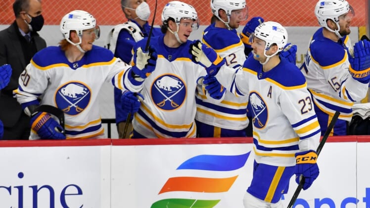 Mar 9, 2021; Philadelphia, Pennsylvania, USA; Buffalo Sabres center Sam Reinhart (23) celebrates his second goal of the game with teammates  against the Philadelphia Flyers during the first period at Wells Fargo Center. Mandatory Credit: Eric Hartline-USA TODAY Sports