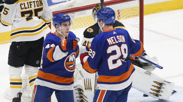 Mar 9, 2021; Uniondale, New York, USA; New York Islanders center Brock Nelson (29) is congratulated by center Jean-Gabriel Pageau (44) after scoring a goal against the Boston Bruins during the second period at Nassau Veterans Memorial Coliseum. Mandatory Credit: Andy Marlin-USA TODAY Sports