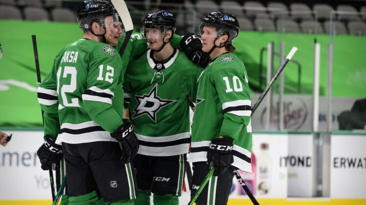 Mar 9, 2021; Dallas, Texas, USA; Dallas Stars right wing Denis Gurianov (34) and center Radek Faksa (12) and defenseman John Klingberg (3) and center Ty Dellandrea (10) celebrates a goal scored by Klingberg against the Chicago Blackhawks during the second period at the American Airlines Center. Mandatory Credit: Jerome Miron-USA TODAY Sports