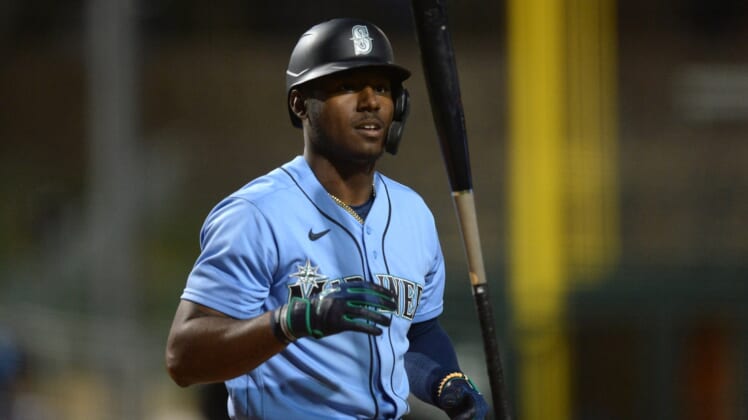 Mar 11, 2021; Phoenix, Arizona, USA; Seattle Mariners right fielder Kyle Lewis (1) flips his bat after striking out against the Los Angeles Dodgers during the third inning of a spring training game at Camelback Ranch-Glendale. Mandatory Credit: Joe Camporeale-USA TODAY Sports