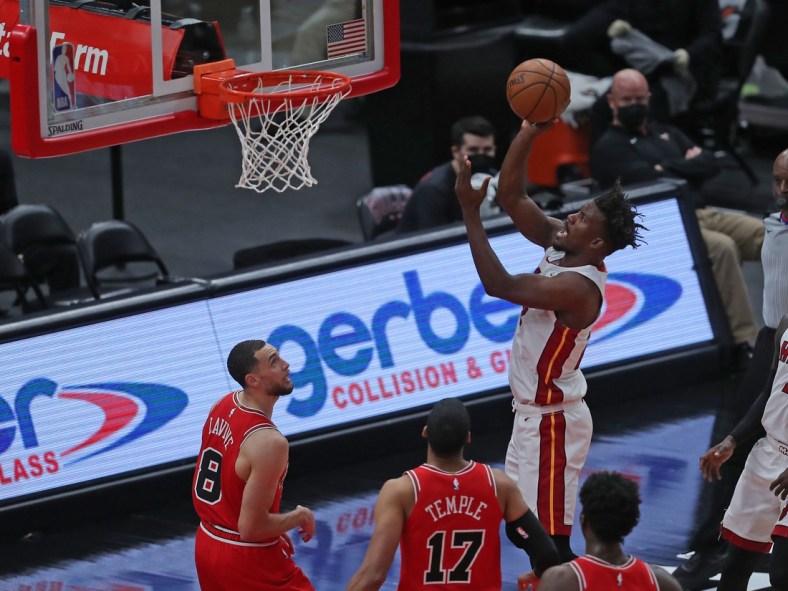 Mar 12, 2021; Chicago, Illinois, USA; Miami Heat forward Jimmy Butler (22) takes a shot with Chicago Bulls guard Zach LaVine (8) looking for the rebound during the first quarter at the United Center. Mandatory Credit: Dennis Wierzbicki-USA TODAY Sports
