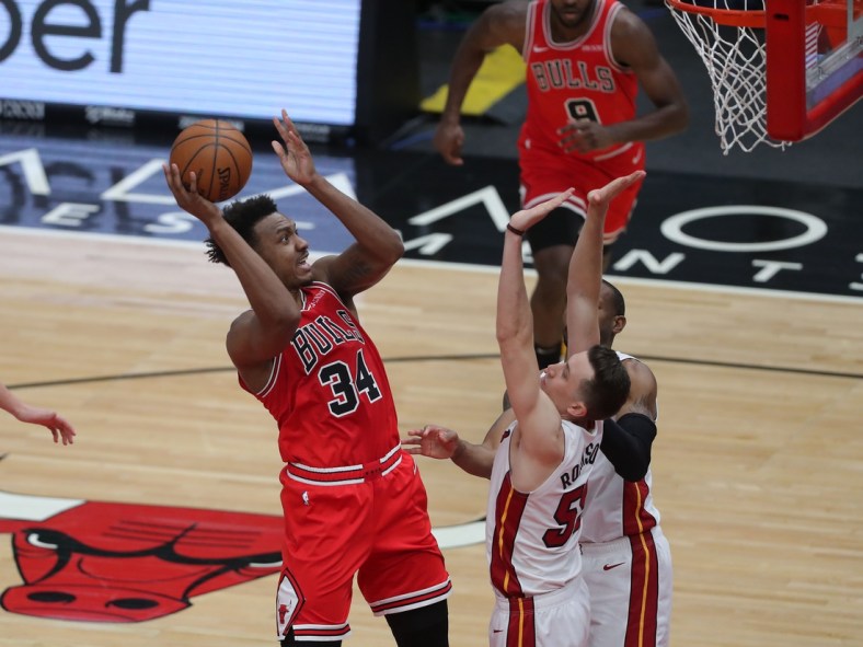 Mar 12, 2021; Chicago, Illinois, USA; Chicago Bulls center Wendell Carter Jr. (34) shoots over Miami Heat guard Duncan Robinson (55) during the second quarter at the United Center. Mandatory Credit: Dennis Wierzbicki-USA TODAY Sports