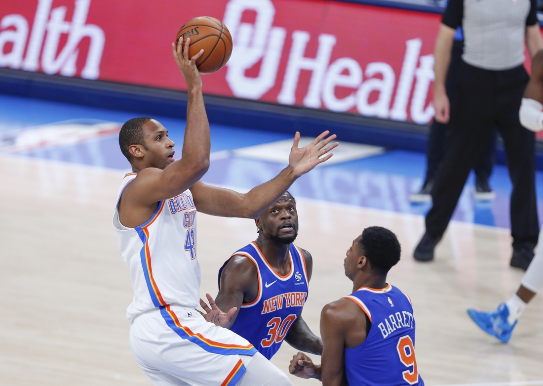 Mar 13, 2021; Oklahoma City, Oklahoma, USA; Oklahoma City Thunder center Al Horford (42) shoots over New York Knicks forward Julius Randle (30) and guard RJ Barrett (9) during the first quarter at Chesapeake Energy Arena. Mandatory Credit: Alonzo Adams-USA TODAY Sports