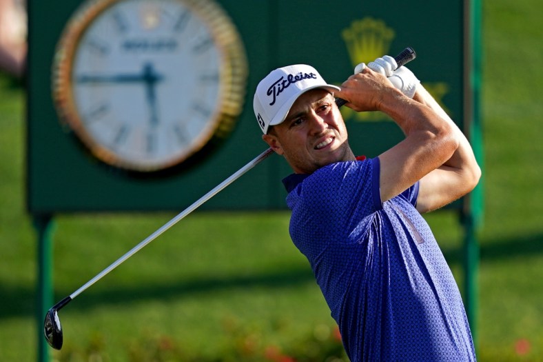 Mar 14, 2021; Ponte Vedra Beach, Florida, USA; Justin Thomas plays his shot from the 18th tee during the final round of The Players Championship golf tournament at TPC Sawgrass - Stadium Course. Mandatory Credit: Jasen Vinlove-USA TODAY Sports
