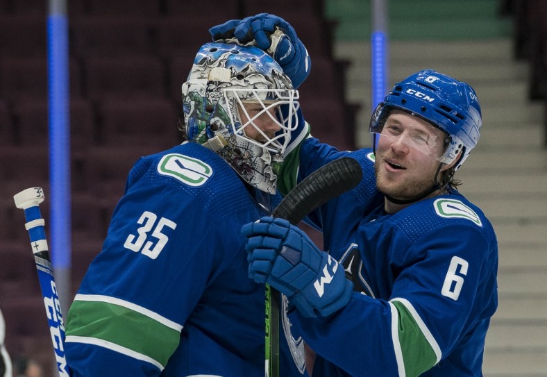 Mar 13, 2021; Vancouver, British Columbia, CAN; Vancouver Canucks goalie Thatcher Demko (35) and forward Brock Boeser (6) celebrate the Canucks victory over the Edmonton Oilers at Rogers Arena. Mandatory Credit: Bob Frid-USA TODAY Sports