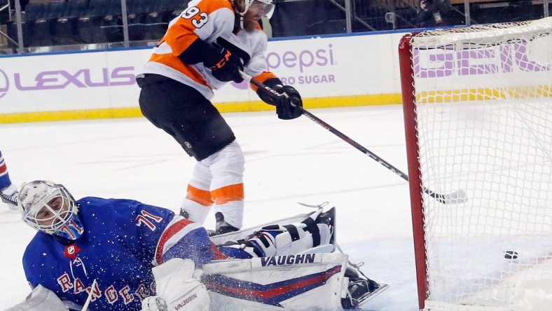 Mar 15, 2021; New York, New York, USA;  Jakub Voracek #93 of the Philadelphia Flyers scores at 3:47 of overtime against Keith Kinkaid #71 of the New York Rangers at Madison Square Garden on March 15, 2021 in New York City. The Flyers defeated the Rangers 5-4 in overtime.  Mandatory Credit:  Bruce Bennett/POOL PHOTOS-USA TODAY Sports