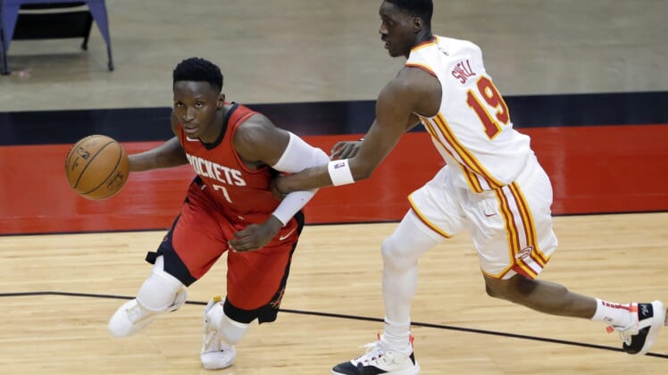 Mar 16, 2021; Houston, Texas, USA; Houston Rockets guard Victor Oladipo (7) is fouled as he drives around Atlanta Hawks guard Tony Snell (19) during the second half at Toyota Center. Mandatory Credit: Michael Wyke/POOL PHOTOS-USA TODAY Sports