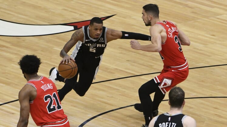 Mar 17, 2021; Chicago, Illinois, USA; San Antonio Spurs guard Dejounte Murray (5) drives the ball while defended by Chicago Bulls guard Tomas Satoransky (31) during the first half at United Center. Mandatory Credit: David Banks-USA TODAY Sports