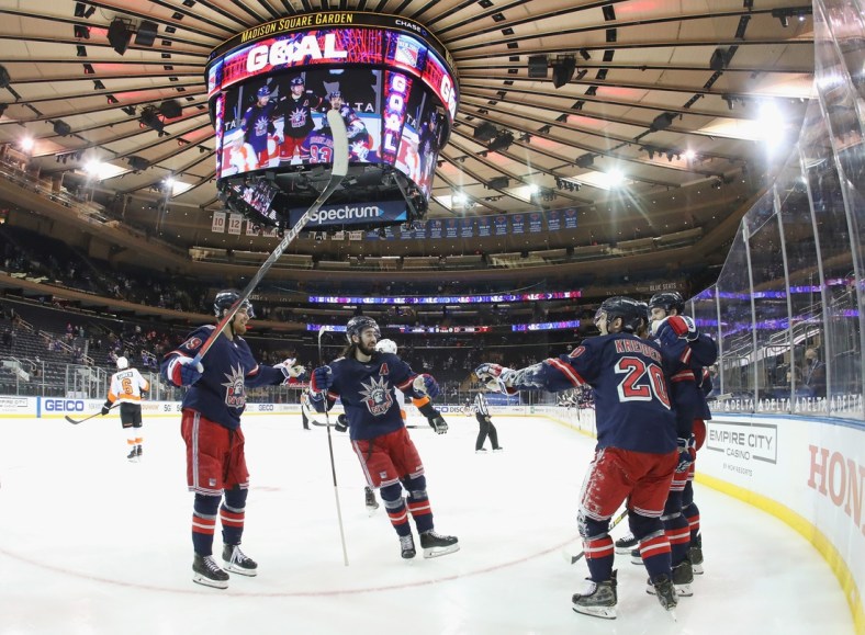 Mar 17, 2021; New York, New York, USA; The New York Rangers celebrate after a goal by right wing Pavel Buchnevich (89) against the Philadelphia Flyers at 1:38 of the second period at Madison Square Garden. Mandatory Credit:  Bruce Bennett/POOL PHOTOS-USA TODAY Sports