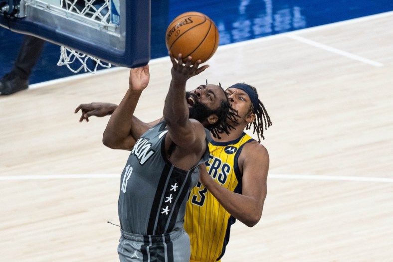 Mar 17, 2021; Indianapolis, Indiana, USA; Brooklyn Nets guard James Harden (13) shoots the ball while Indiana Pacers center Myles Turner (33) defends  in the fourth quarter at Bankers Life Fieldhouse. Mandatory Credit: Trevor Ruszkowski-USA TODAY Sports