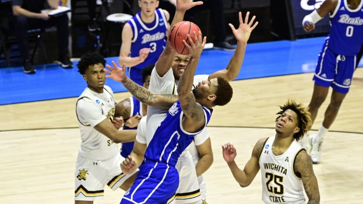 Mar 18, 2021; West Lafayette, Indiana, USA; Wichita State Shockers guard Dexter Dennis (0) defends against Drake Bulldogs forward Tremell Murphy (2) in the first half during the First Four of the 2021 NCAA Tournament at Mackey Arena. Mandatory Credit: Marc Lebryk-USA TODAY Sports