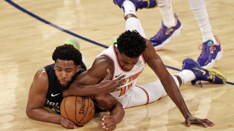 Mar 18, 2021; New York, New York, USA;    Orlando Magic guard Chasson Randle and New York Knicks guard Frank Ntilikina dive for a loose ball during the first half of an NBA basketball game Thursday, March 18, 2021, in New York. Mandatory Credit: Adam Hunger/Pool Photo-USA TODAY Sports