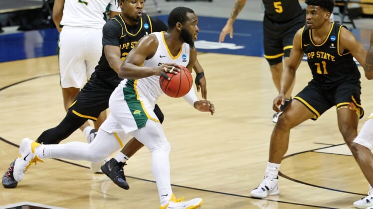 Mar 18, 2021; Bloomington, Indiana, USA; Norfolk State Spartans guard Joe Bryant Jr. (4) dribbles as Appalachian State Mountaineers guard Adrian Delph (20) pursues during the first half in the First Four of the 2021 NCAA Tournament at Simon Skjodt Assembly Hall. Mandatory Credit: Trevor Ruszkowski-USA TODAY Sports