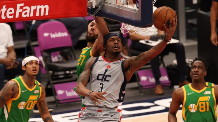Mar 18, 2021; Washington, District of Columbia, USA; Washington Wizards guard Bradley Beal (3) shoots the ball as Utah Jazz center Rudy Gobert (27) defends in the third quarter at Capital One Arena. Mandatory Credit: Geoff Burke-USA TODAY Sports
