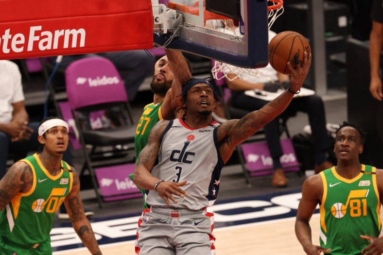 Mar 18, 2021; Washington, District of Columbia, USA; Washington Wizards guard Bradley Beal (3) shoots the ball as Utah Jazz center Rudy Gobert (27) defends in the third quarter at Capital One Arena. Mandatory Credit: Geoff Burke-USA TODAY Sports