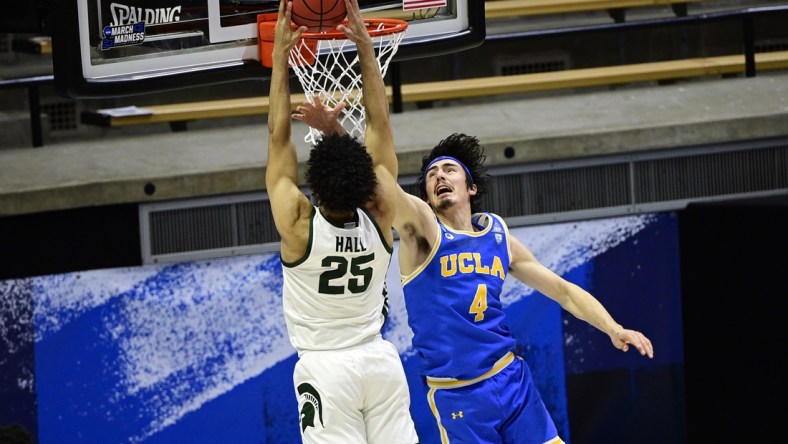 Mar 18, 2021; West Lafayette, Indiana, USA; UCLA Bruins guard Jaime Jaquez Jr. (4) defends against Michigan State Spartans forward Malik Hall (25) in the second half during the First Four of the 2021 NCAA Tournament at Mackey Arena. Mandatory Credit: Marc Lebryk-USA TODAY Sports