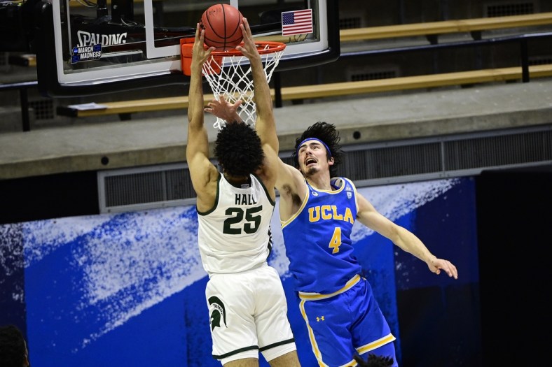 Mar 18, 2021; West Lafayette, Indiana, USA; UCLA Bruins guard Jaime Jaquez Jr. (4) defends against Michigan State Spartans forward Malik Hall (25) in the second half during the First Four of the 2021 NCAA Tournament at Mackey Arena. Mandatory Credit: Marc Lebryk-USA TODAY Sports