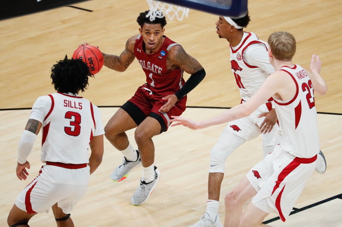 Colgate Raiders guard Jordan Burns (1) attempts to maneuver around Arkansas Razorbacks defense during the first round of the 2021 NCAA Tournament on Friday, March 19, 2021, at Bankers Life Fieldhouse in Indianapolis, Ind. Mandatory Credit: Adam Cairns/IndyStar via USA TODAY Sports