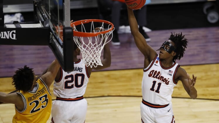 Mar 19, 2021; Indianapolis, Indiana, USA; Illinois Fighting Illini guard Ayo Dosunmu (11) grabs a rebound against the Drexel Dragons during the first round of the 2021 NCAA Tournament at Indiana Farmers Coliseum. Mandatory Credit: Aaron Doster-USA TODAY Sports