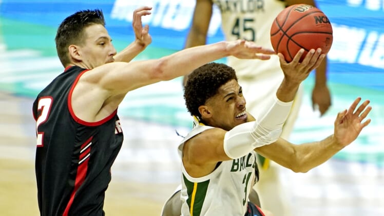 Mar 19, 2021; Indianapolis, Indiana, USA; Baylor Bears guard MaCio Teague (31) shoots the ball against Hartford Hawks forward Miroslav Stafl (12) during the first half during the first round of the 2021 NCAA Tournament at Lucas Oil Stadium. Mandatory Credit: Andrew Nelles-USA TODAY Sports