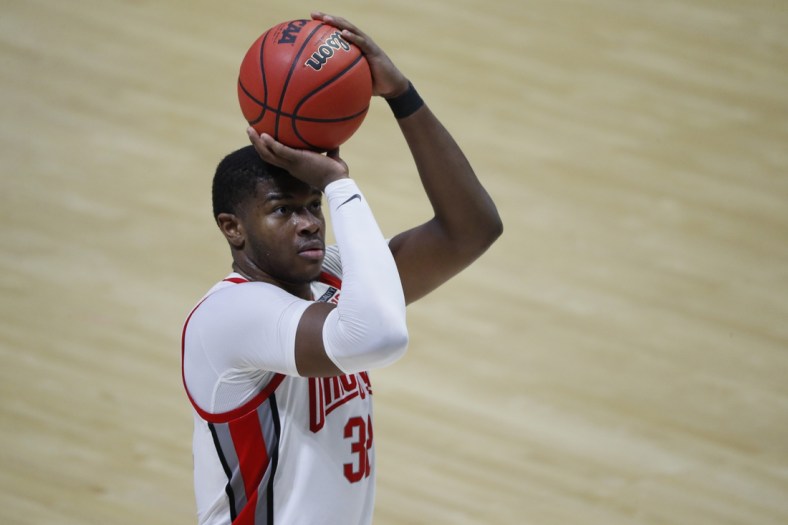 Mar 19, 2021; West Lafayette, Indiana, USA; Ohio State Buckeyes forward E.J. Liddell (32) shoots a free throw against the Oral Roberts Golden Eagles during the second half in the first round of the 2021 NCAA Tournament at Mackey Arena. Mandatory Credit: Joshua Bickel-USA TODAY Sports