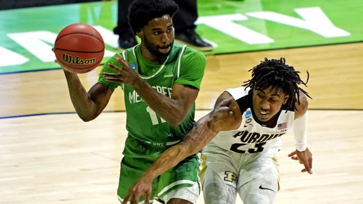 Mar 19, 2021; Indianapolis, Indiana, USA; North Texas Mean Green guard JJ Murray (11) handles the ball against Purdue Boilermakers guard Jaden Ivey (23) during the first half in the first round of the 2021 NCAA Tournament at Lucas Oil Stadium. Mandatory Credit: Andrew Nelles-USA TODAY Sports