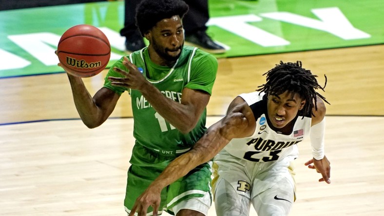 Mar 19, 2021; Indianapolis, Indiana, USA; North Texas Mean Green guard JJ Murray (11) handles the ball against Purdue Boilermakers guard Jaden Ivey (23) during the first half in the first round of the 2021 NCAA Tournament at Lucas Oil Stadium. Mandatory Credit: Andrew Nelles-USA TODAY Sports