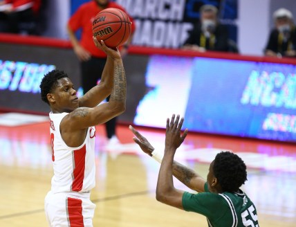 Mar 19, 2021; Bloomington, Indiana, USA; Houston Cougars guard Marcus Sasser (0) shoots against Cleveland State Vikings guard D'Moi Hodge (55) during the second half in the first round of the 2021 NCAA Tournament at Simon Skjodt Assembly Hall. Mandatory Credit: Jordan Prather-USA TODAY Sports