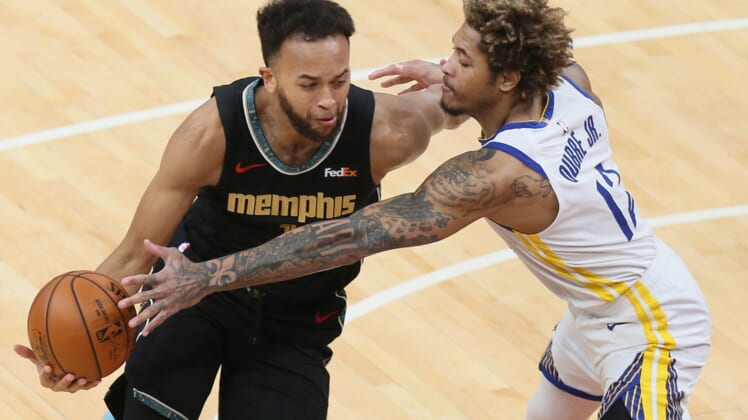 Mar 19, 2021; Memphis, Tennessee, USA; Memphis Grizzlies forward Kyle Anderson (1) has the ball knocked away by Golden State Warriors guard Kelly Oubre Jr. (12) during the first quarter at FedExForum. Mandatory Credit: Nelson Chenault-USA TODAY Sports
