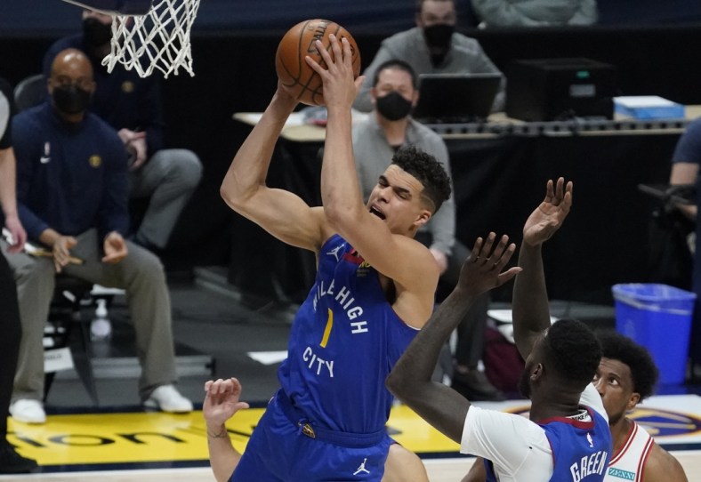 Mar 19, 2021; Denver, Colorado, USA; Denver Nuggets forward Michael Porter Jr. (1) pulls in a rebound in the second quarter against the Denver Nuggets at Ball Arena. Mandatory Credit: Ron Chenoy-USA TODAY Sports