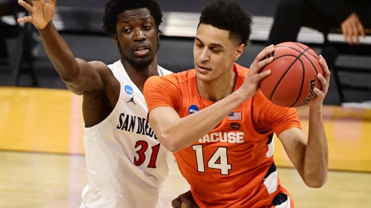 Mar 19, 2021; Indianapolis, Indiana, USA; Syracuse Orange center Jesse Edwards (14) is defended by San Diego State Aztecs forward Nathan Mensah (31) during the first round of the 2021 NCAA Tournament at Hinkle Fieldhouse. Mandatory Credit: Marc Lebryk-USA TODAY Sports