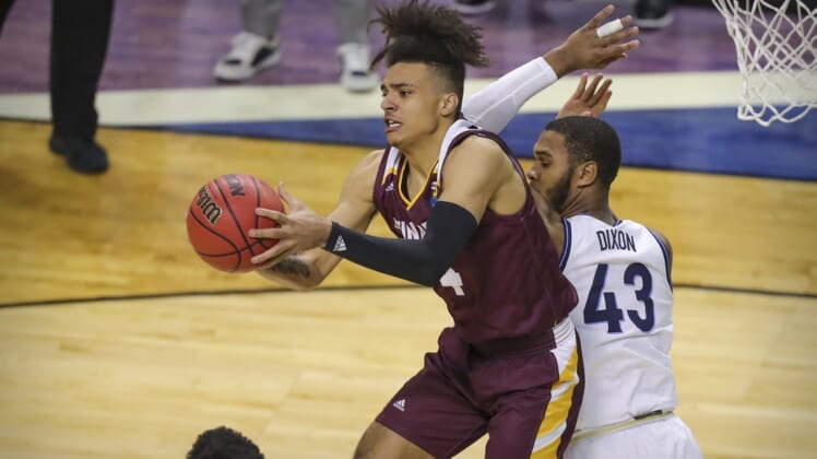 Mar 19, 2021; Indianapolis, IN, USA; Winthrop Eagles forward Kelton Talford (4) grabs a rebound in front of Villanova Wildcats forward Eric Dixon (43) during the first round of the 2021 NCAA Tournament at Indiana Farmers Coliseum.  Mandatory Credit: Katie Stratman-USA TODAY Sports