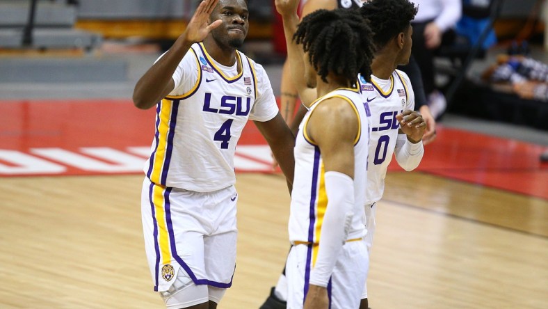 Mar 20, 2021; Bloomington, Indiana, USA; Louisiana State Tigers forward Darius Days (4) celebrates with forward Trendon Watford (2) and forward Mwani Wilkinson (0) against the St. Bonaventure Bonnies during the second half in the first round of the 2021 NCAA Tournament at Simon Skjodt Assembly Hall. Mandatory Credit: Jordan Prather-USA TODAY Sports