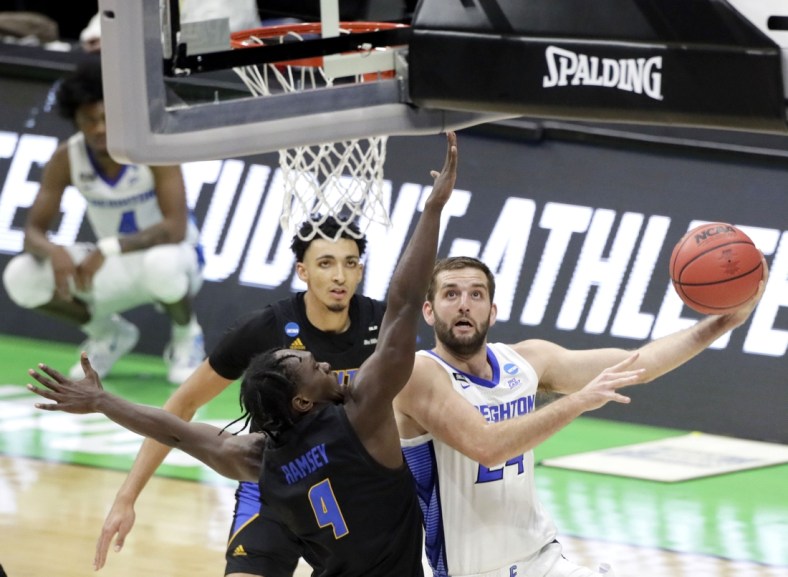 Creighton Bluejays guard Mitch Ballock (24) goes up for a shot while being guarded by UC Santa Barbara Gauchos guard Devearl Ramsey (4) during the first round of the 2021 NCAA Tournament on Saturday, March 20, 2021, at Lucas Oil Stadium in Indianapolis, Ind. Mandatory Credit: Barbara Perenic/IndyStar via USA TODAY Sports