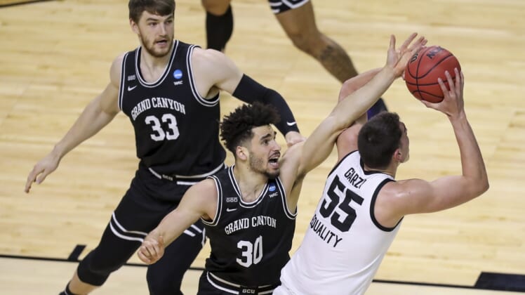 Mar 20, 2021; Indianapolis, IN, USA; Grand Canyon Antelopes center Asbj rn Midtgaard (33) and forward Gabe McGlothan (30) defend against Iowa Hawkeyes center Luka Garza (55) during the first round of the 2021 NCAA Tournament at Indiana Farmers Coliseum.  Mandatory Credit: Katie Stratman-USA TODAY Sports
