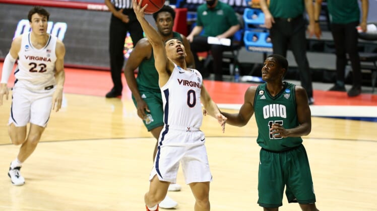 Mar 20, 2021; Bloomington, Indiana, USA; Virginia Cavaliers guard Kihei Clark (0) moves in for a basket ahead of Ohio Bobcats guard Lunden McDay (15) during the first round of the 2021 NCAA Tournament at Simon Skjodt Assembly Hall. Mandatory Credit: Jordan Prather-USA TODAY Sports