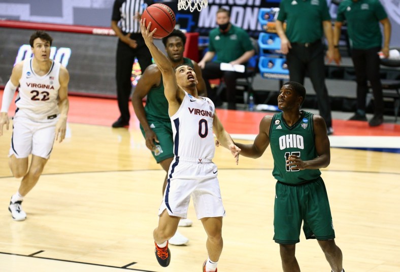 Mar 20, 2021; Bloomington, Indiana, USA; Virginia Cavaliers guard Kihei Clark (0) moves in for a basket ahead of Ohio Bobcats guard Lunden McDay (15) during the first round of the 2021 NCAA Tournament at Simon Skjodt Assembly Hall. Mandatory Credit: Jordan Prather-USA TODAY Sports