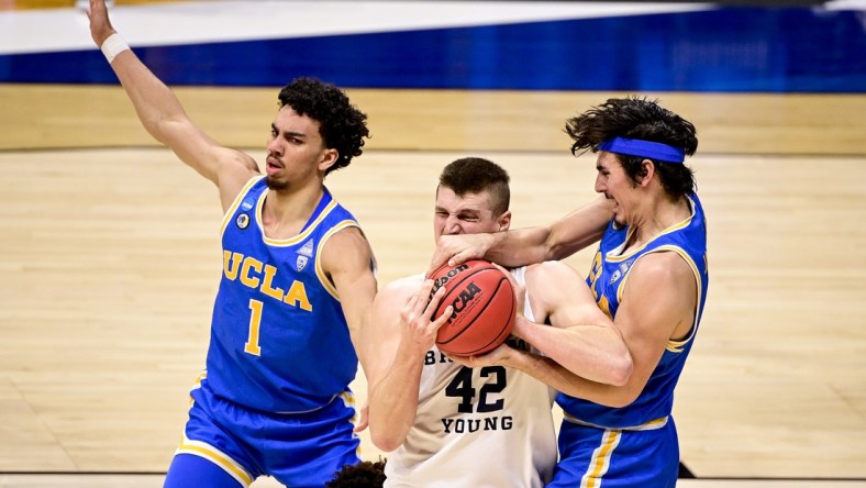 Mar 20, 2021; Indianapolis, IN, USA; Brigham Young Cougars center Richard Harward (42) and UCLA Bruins guard Jaime Jaquez Jr. (4) fight for the rebound iduring the first round of the 2021 NCAA Tournament at Hinkle Fieldhouse.  Mandatory Credit: Marc Lebryk-USA TODAY Sports