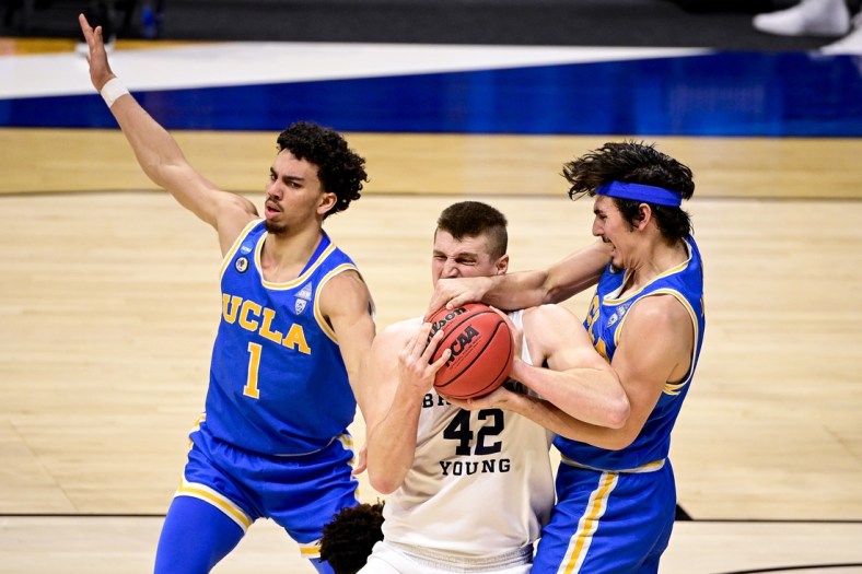 Mar 20, 2021; Indianapolis, IN, USA; Brigham Young Cougars center Richard Harward (42) and UCLA Bruins guard Jaime Jaquez Jr. (4) fight for the rebound iduring the first round of the 2021 NCAA Tournament at Hinkle Fieldhouse.  Mandatory Credit: Marc Lebryk-USA TODAY Sports