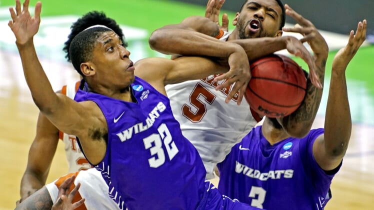 Mar 20, 2021; Indianapolis, Indiana, USA; Texas Longhorns forward Royce Hamm Jr. (5) and t32 go for a rebound during the first half in the first round of the 2021 NCAA Tournament at Lucas Oil Stadium. Mandatory Credit:  Andrew Nelles-USA TODAY Sports