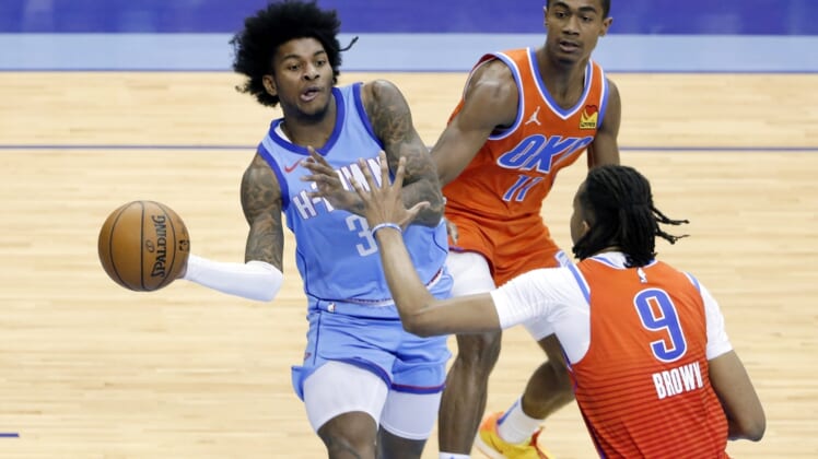 Mar 21, 2021; Houston, TX, USA; Houston Rockets guard Kevin Porter Jr. (3) passes the ball under pressure from Oklahoma City Thunder guard Theo Maledon (11) and Oklahoma City Thunder center Moses Brown (9) during the second half of an NBA basketball game Sunday, March 21, 2021, in Houston. Mandatory Credit: Michael Wyke/Pool Photo-USA TODAY Sports