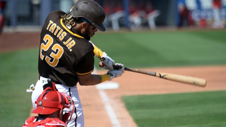 Mar 21, 2021; Peoria, Arizona, USA; San Diego Padres shortstop Fernando Tatis Jr. (23) bats against the Los Angeles Angels during the third inning of a spring training game at Peoria Sports Complex. Mandatory Credit: Joe Camporeale-USA TODAY Sports