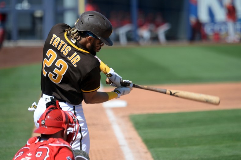 Mar 21, 2021; Peoria, Arizona, USA; San Diego Padres shortstop Fernando Tatis Jr. (23) bats against the Los Angeles Angels during the third inning of a spring training game at Peoria Sports Complex. Mandatory Credit: Joe Camporeale-USA TODAY Sports