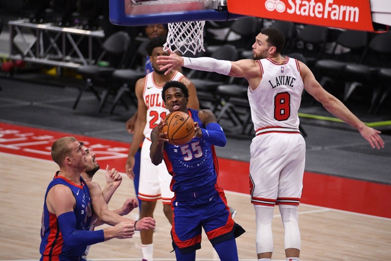 Mar 21, 2021; Detroit, Michigan, USA; Detroit Pistons guard Delon Wright (55) goes to the basket as Chicago Bulls guard Zach LaVine (8) defends during the fourth quarter at Little Caesars Arena. Mandatory Credit: Tim Fuller-USA TODAY Sports