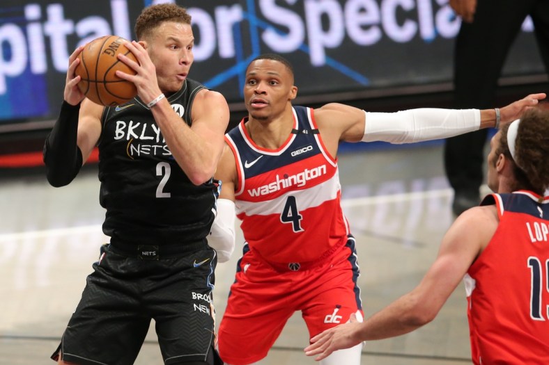 Mar 21, 2021; Brooklyn, New York, USA; Brooklyn Nets power forward Blake Griffin (2) controls the ball against Washington Wizards point guard Russell Westbrook (4) during the second quarter at Barclays Center. Mandatory Credit: Brad Penner-USA TODAY Sports
