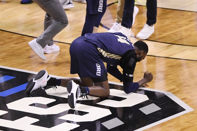 Mar 21, 2021; Indianapolis, IN, USA; Oral Roberts Golden Eagles forward DeShang Weaver (14) reacts to defeating the Florida Gators at Indiana Farmers Coliseum. Mandatory Credit: Doug McSchooler-USA TODAY Sports