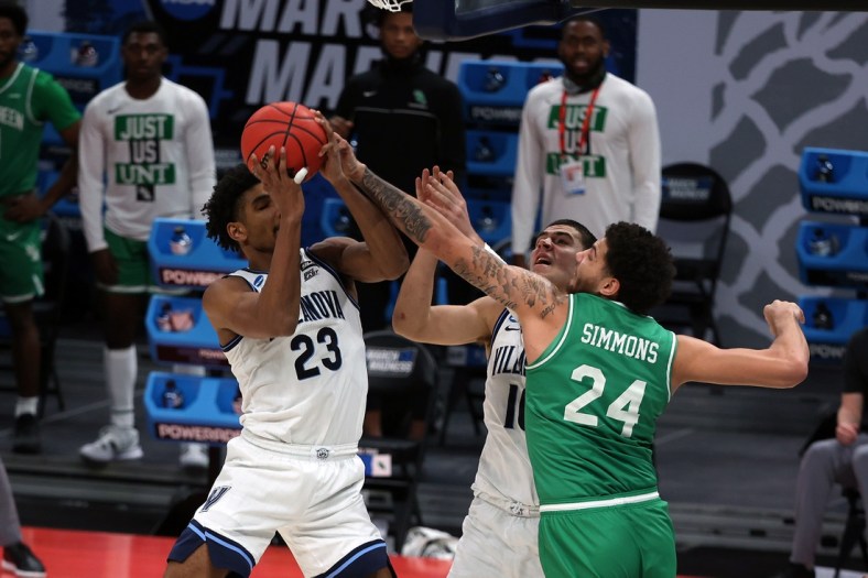 Mar 21, 2021; Indianapolis, Indiana, USA; Villanova Wildcats forward Jermaine Samuels (23) grabs a rebound against North Texas Mean Green forward Zachary Simmons (24) in the second half in the second round of the 2021 NCAA Tournament at Bankers Life Fieldhouse. Mandatory Credit: Trevor Ruszkowski-USA TODAY Sports