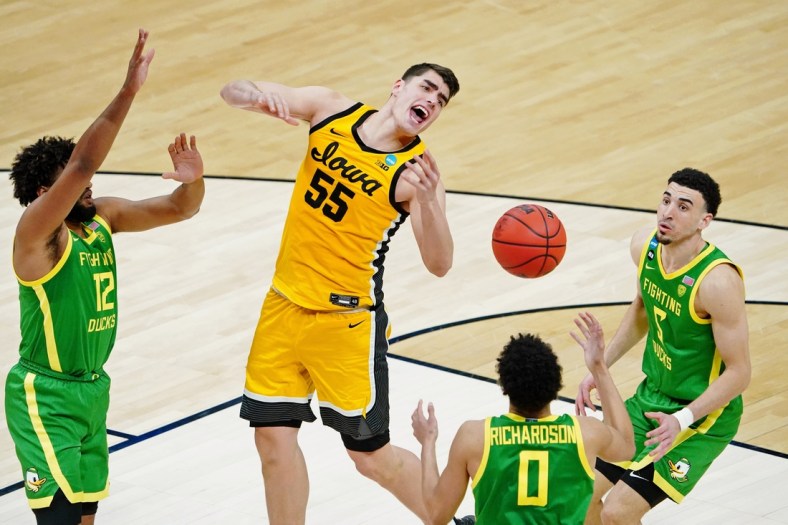 Mar 22, 2021; Indianapolis, Indiana, USA; Iowa Hawkeyes center Luka Garza (55) loses the ball against the Oregon Ducks during the second half in the second round of the 2021 NCAA Tournament at Bankers Life Fieldhouse. Mandatory Credit: Kirby Lee-USA TODAY Sports